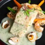 Festival de España 2025 en Hacienda de los Morales: Viaje sensorial por la gastronomía ibérica en CDMX 3 Merluza en Salsa Verde