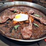 Festival de Arroces 2026 de Grupo Castellano: ocho formas de celebrar el arroz español 8 Paella al Josper con Cordero