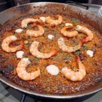 Festival de Arroces 2026 de Grupo Castellano: ocho formas de celebrar el arroz español 5 Socarrat con Camarones azúles